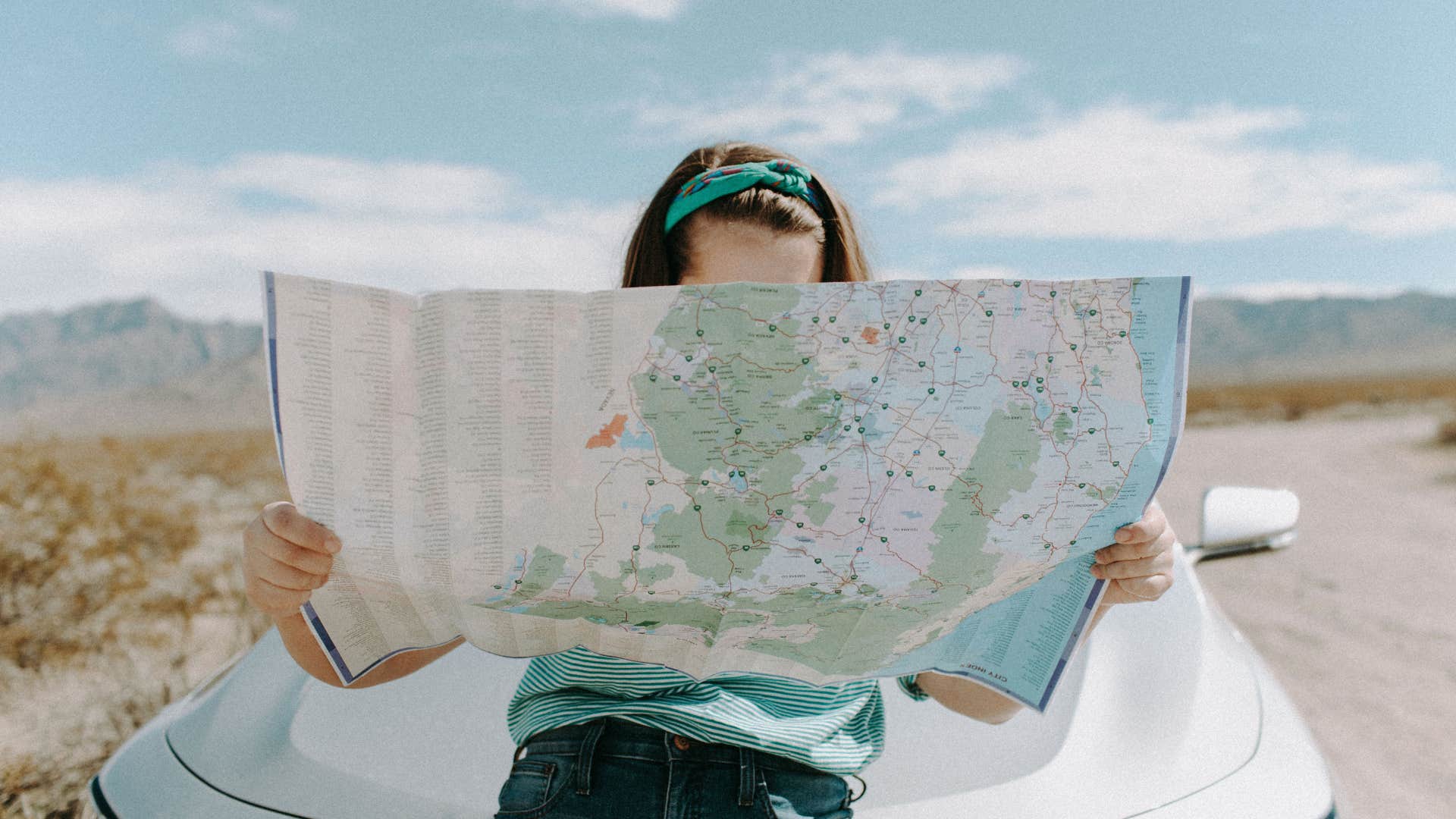 woman raised in the 70s finding her way around with a map
