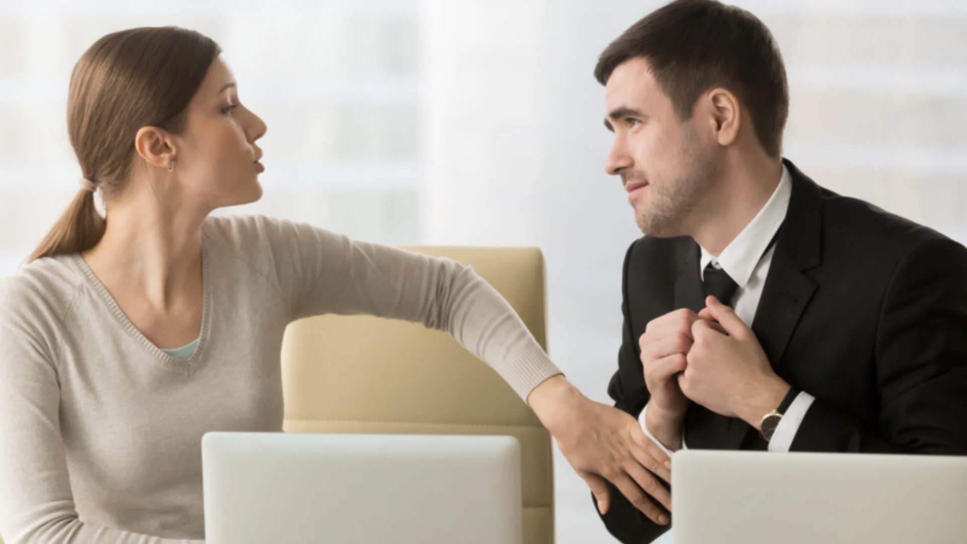 woman telling colleague it's fine i'll handle it