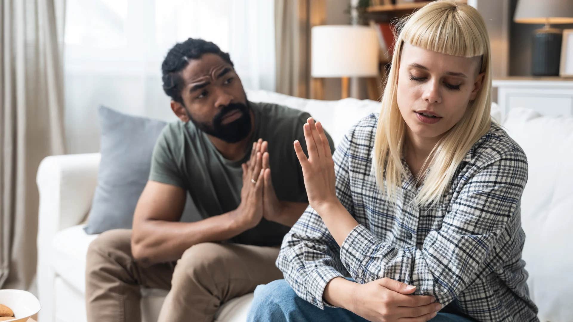 man telling woman that she owes him