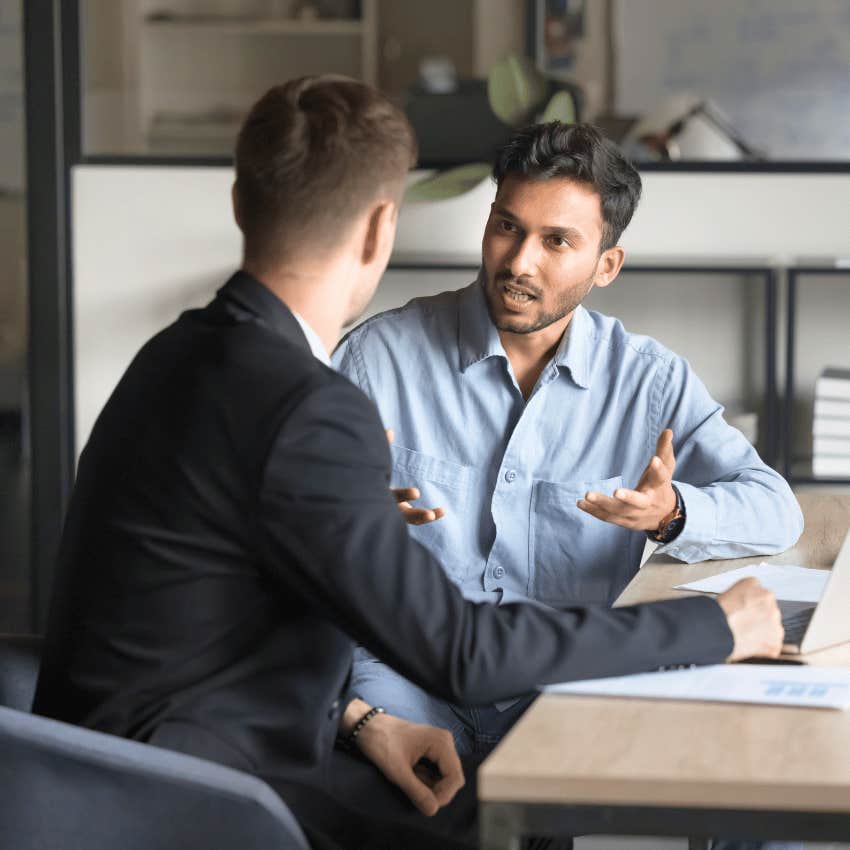 man telling colleague i am here voluntarily but not a volunteer