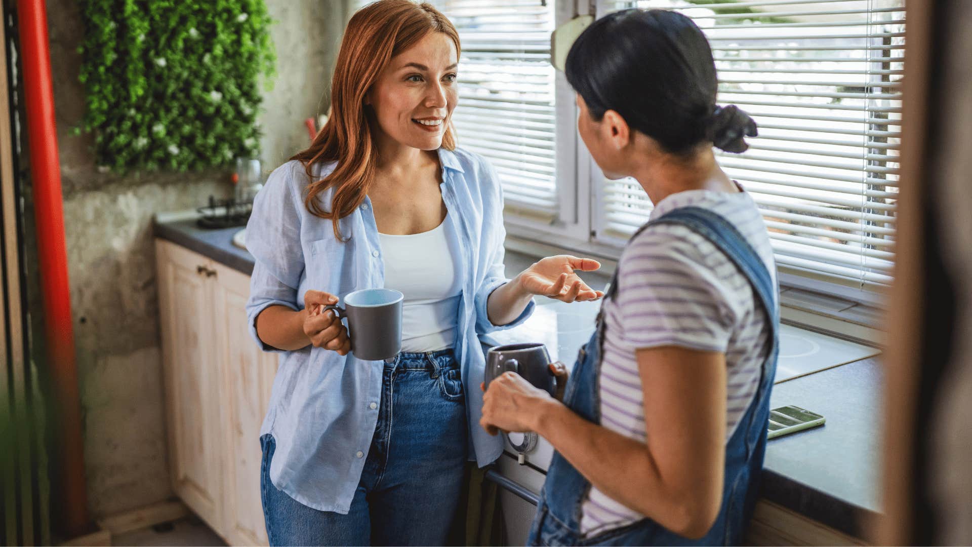 woman with blonde hair telling coworker someone needs to tell you the truth