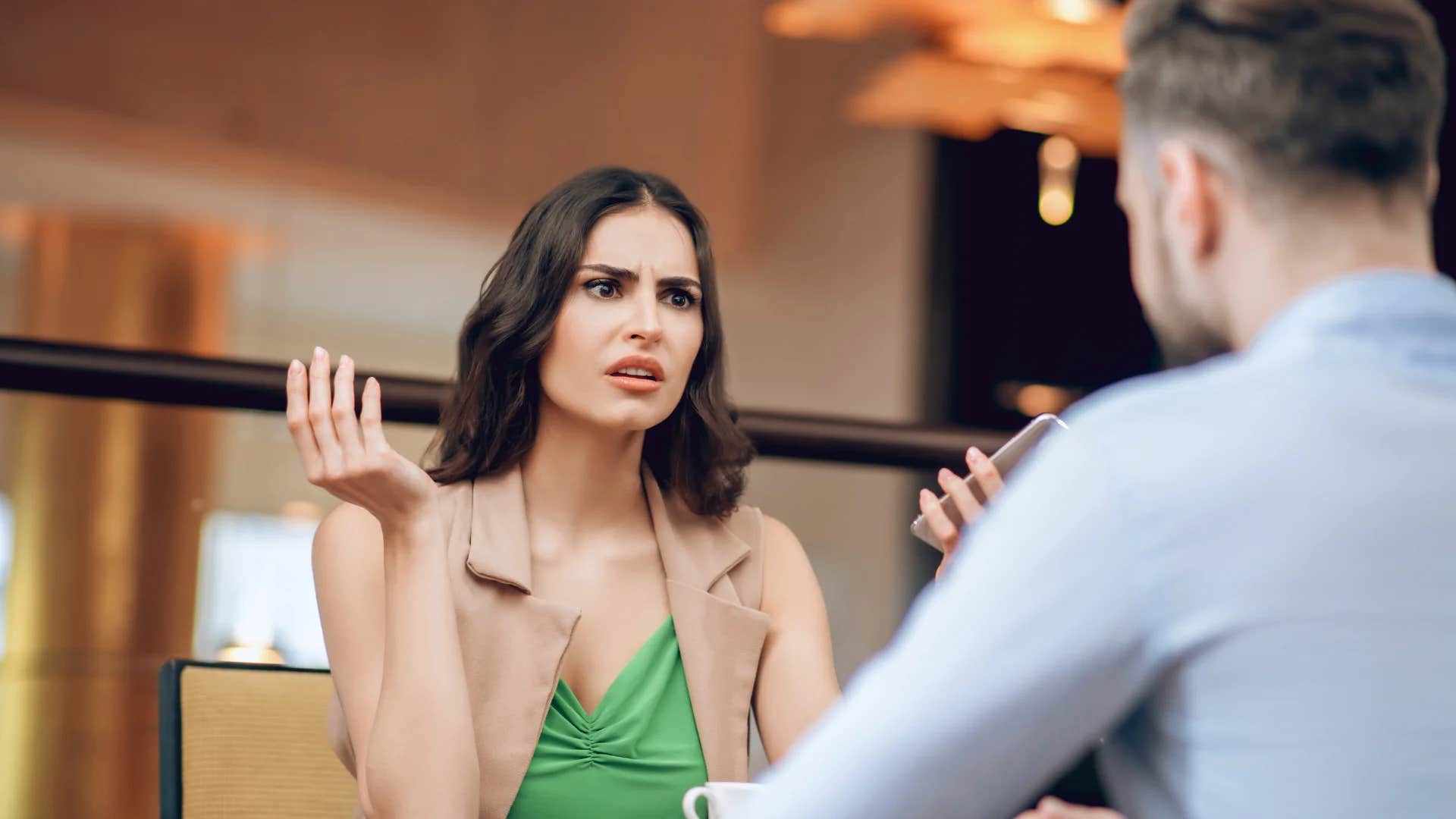 woman with low emotional maturity telling man to calm down
