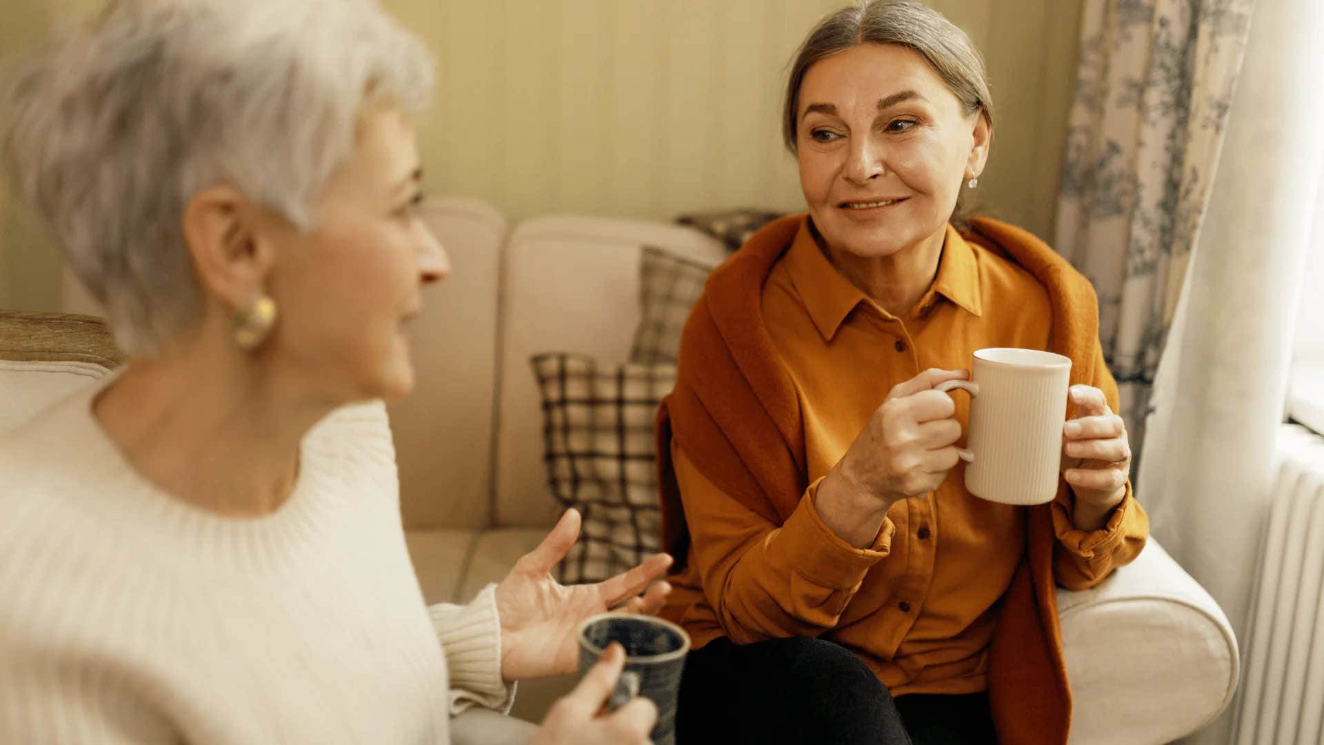 older woman telling friend let's make space for both of us to express our thoughts clearly