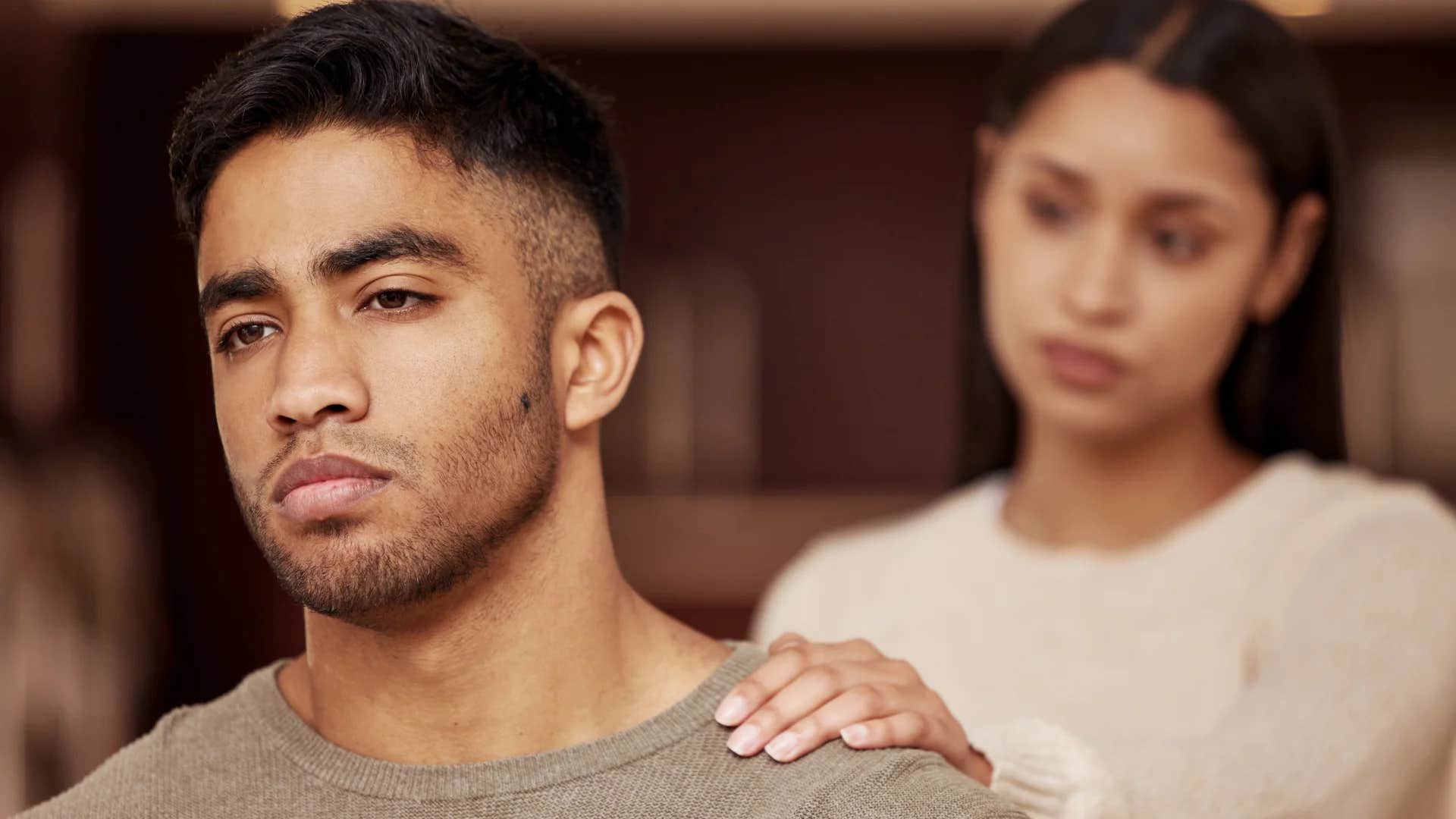 woman telling man he needs a reality check