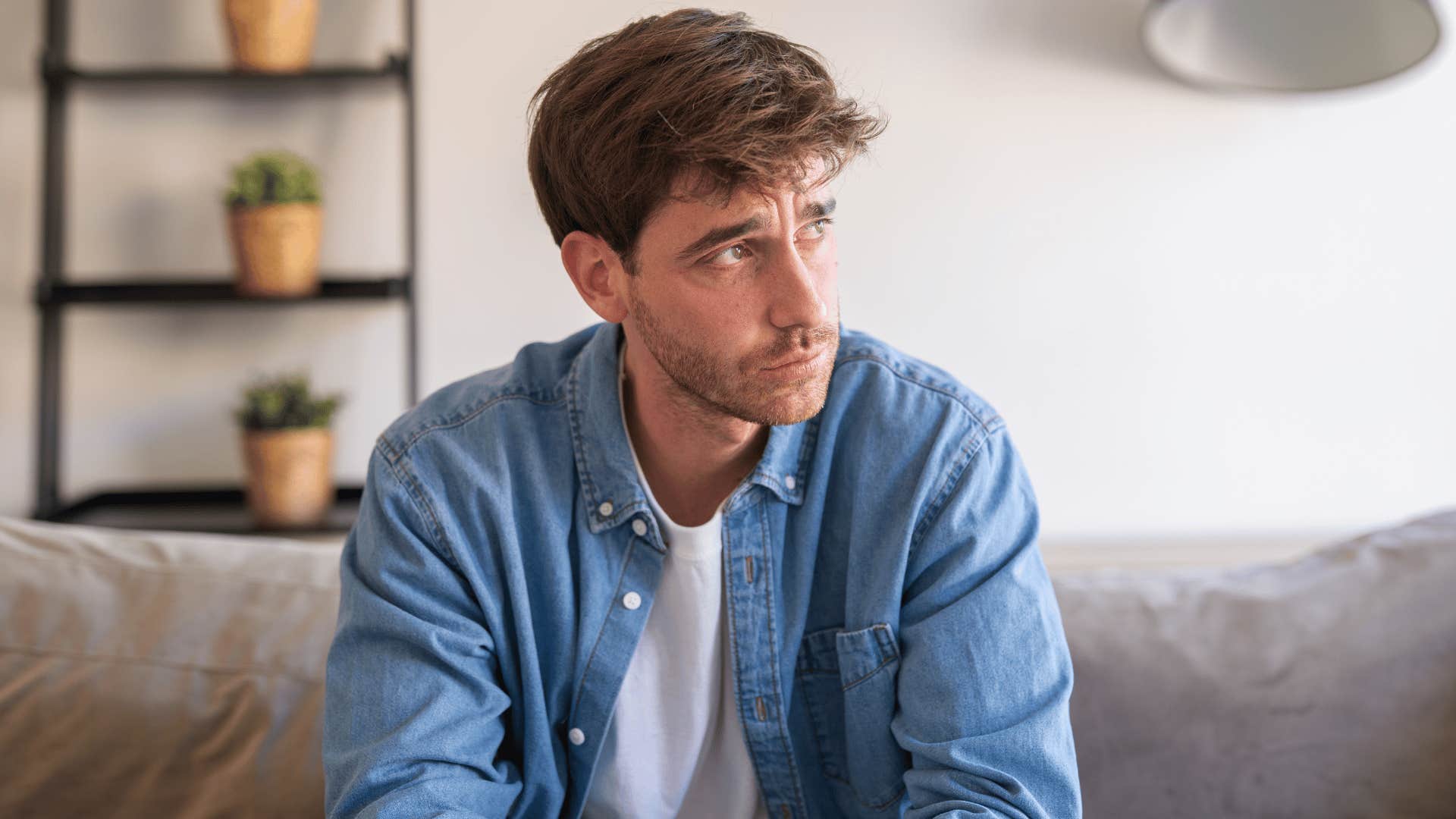 man in denim jacket upset as he thinks i used to think time healed everything