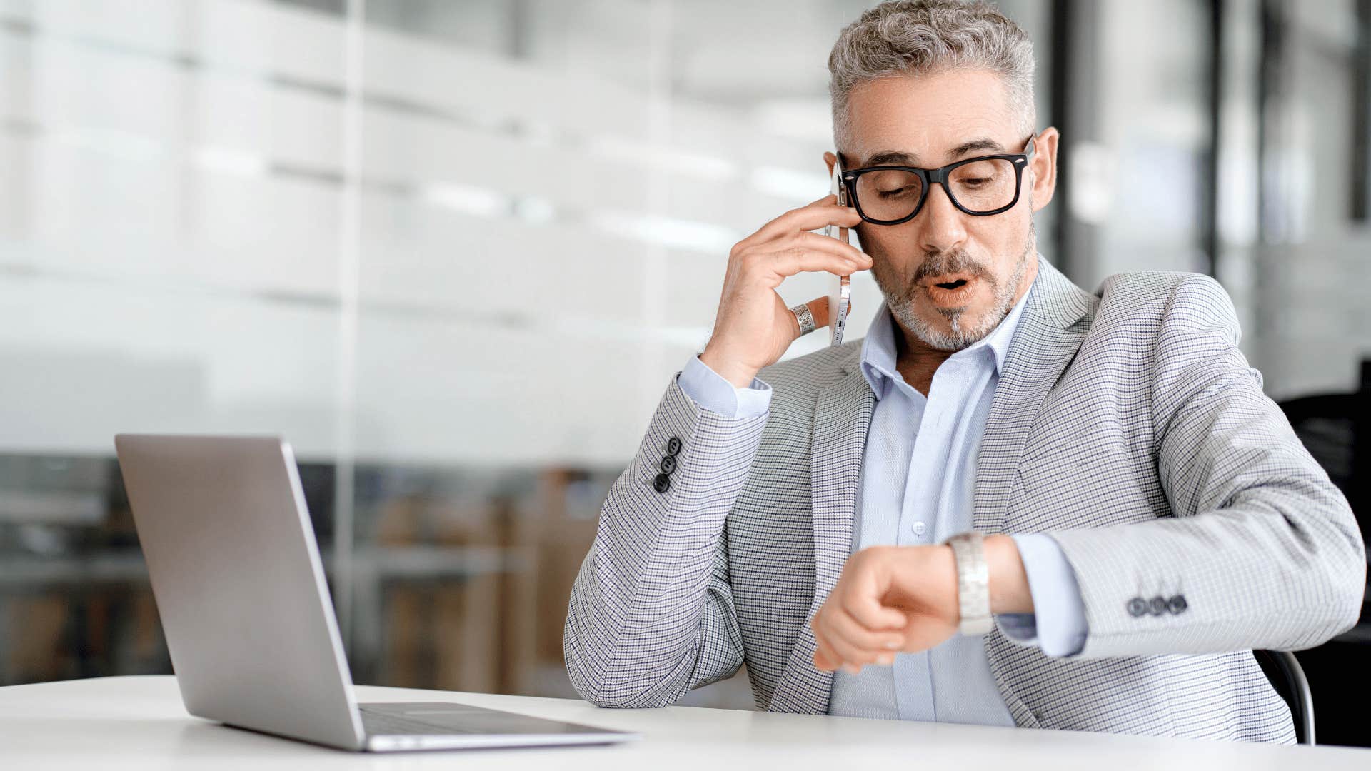 man checking his watch as he says he doesn't have time