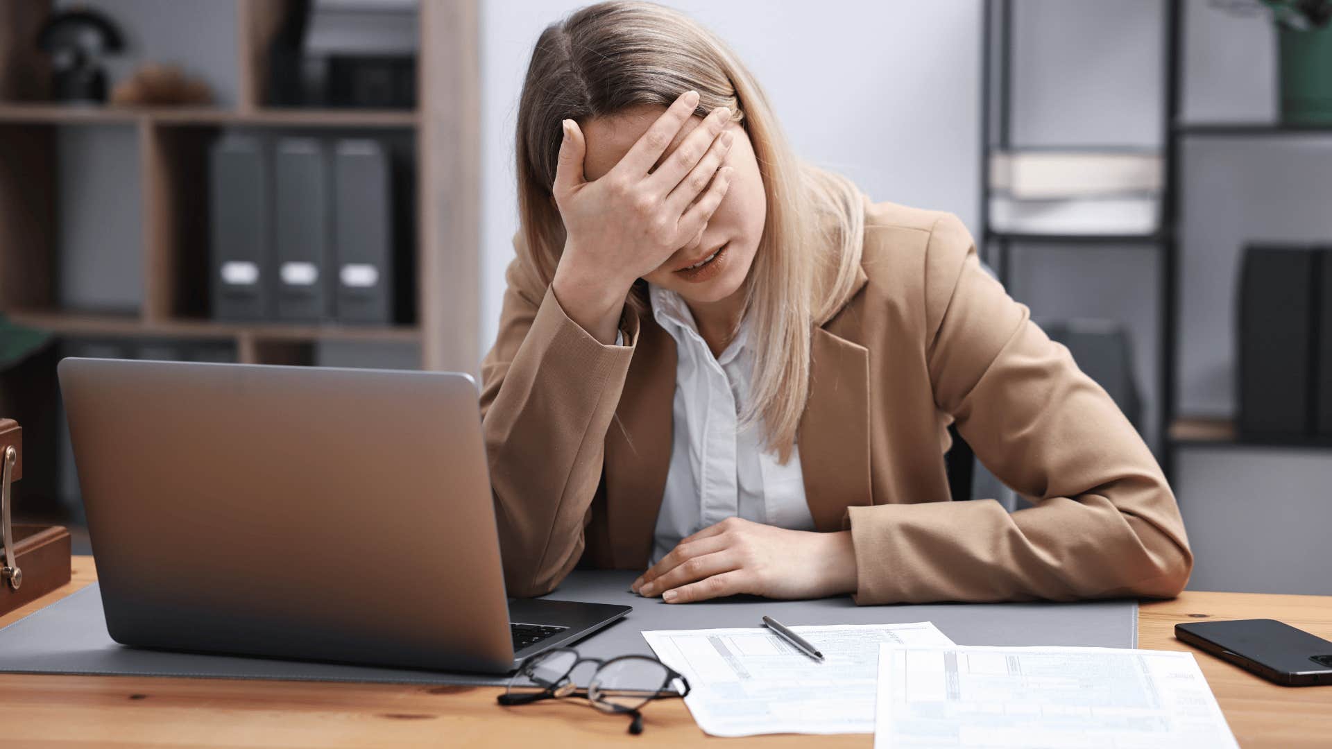 woman covering her face upset as she thinks i don't have the energy for that anymore