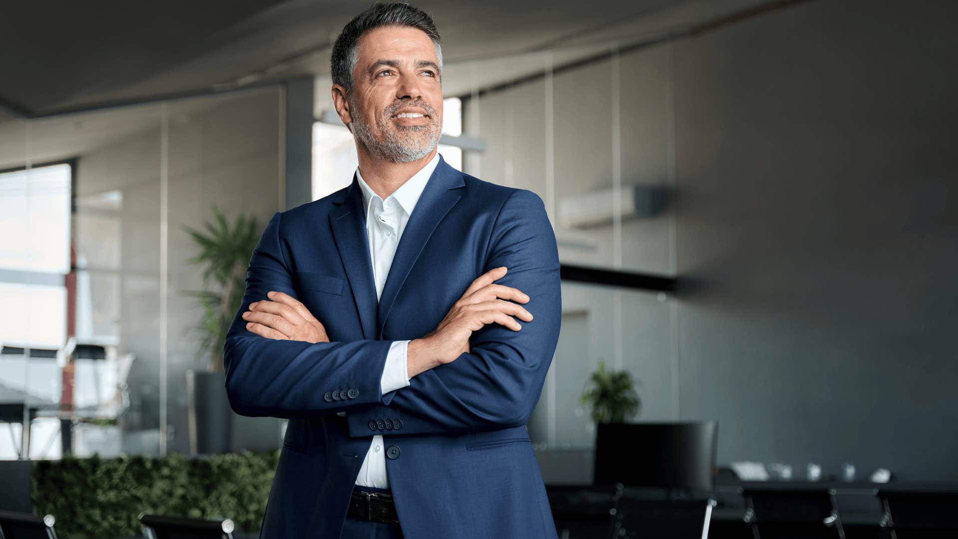 man in suit looking confident as he crosses arms and says i'd rather handle it myself