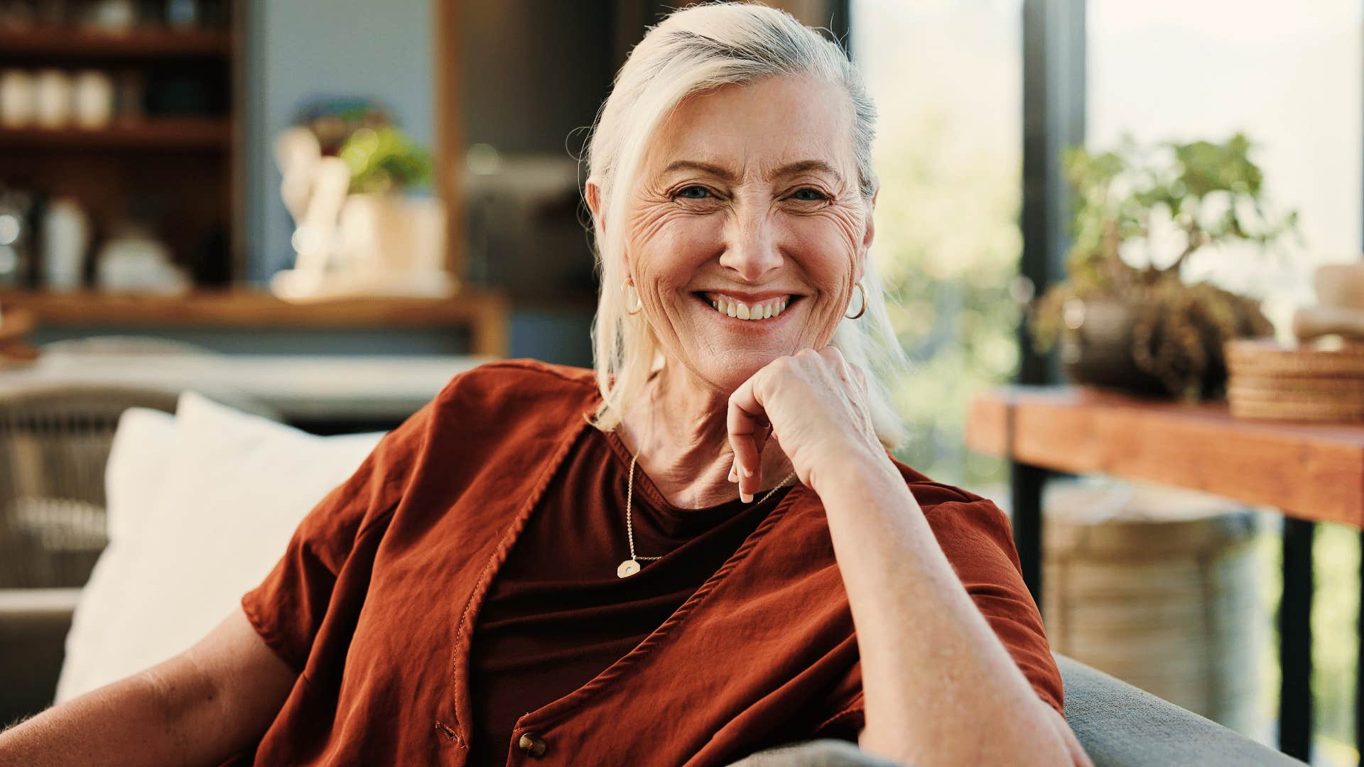 woman in red shirt smiling as she says you don't need to worry about me