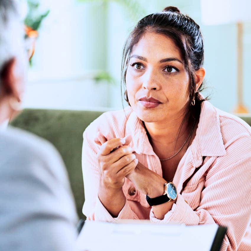 woman losing her happiness telling colleague I have too much to do