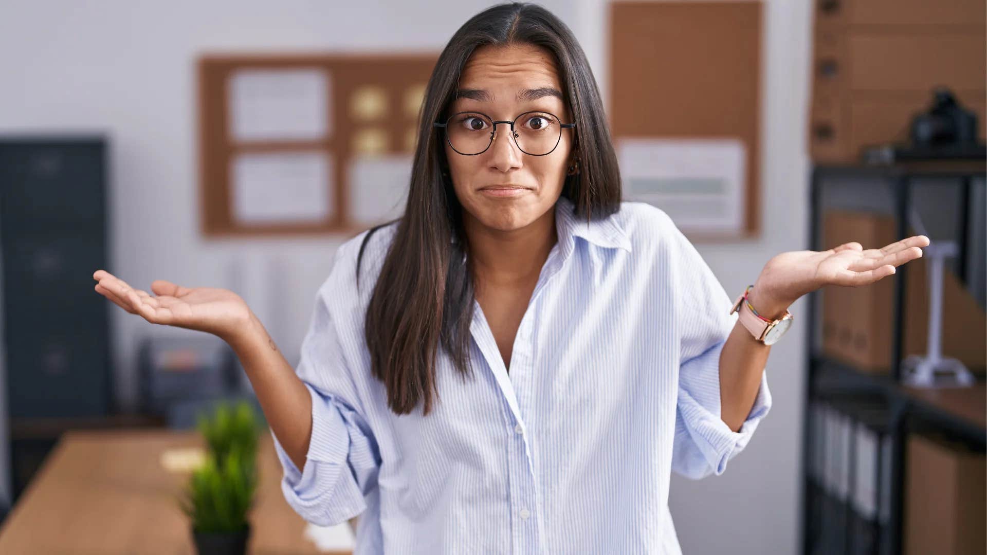 young woman shrugging saying whatever