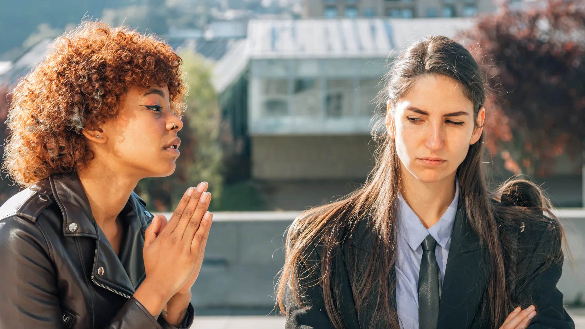 young woman apologizing to friend sorry i'm being so difficult