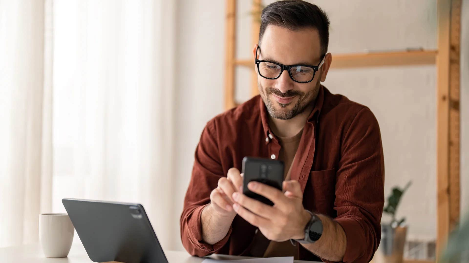 man texting we'll get together another time