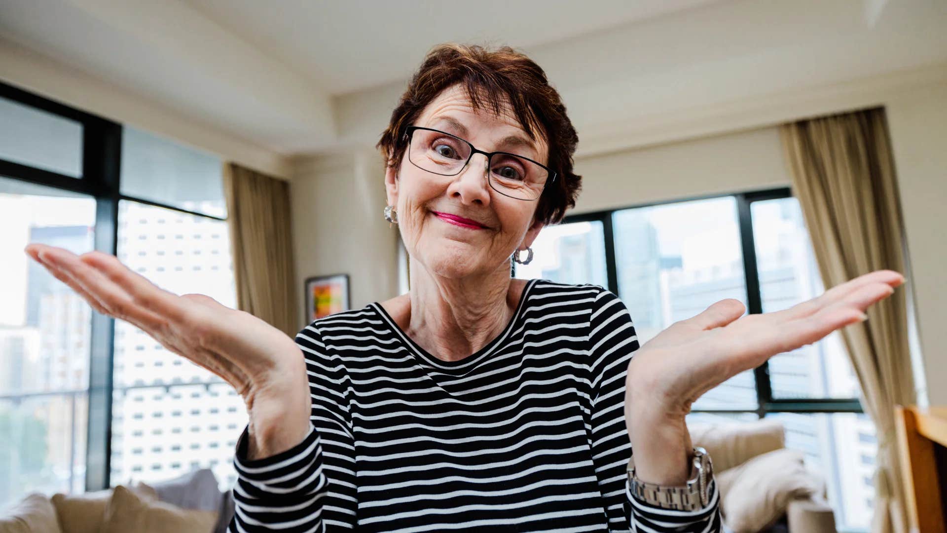 older woman shrugging saying that's your problem not mine