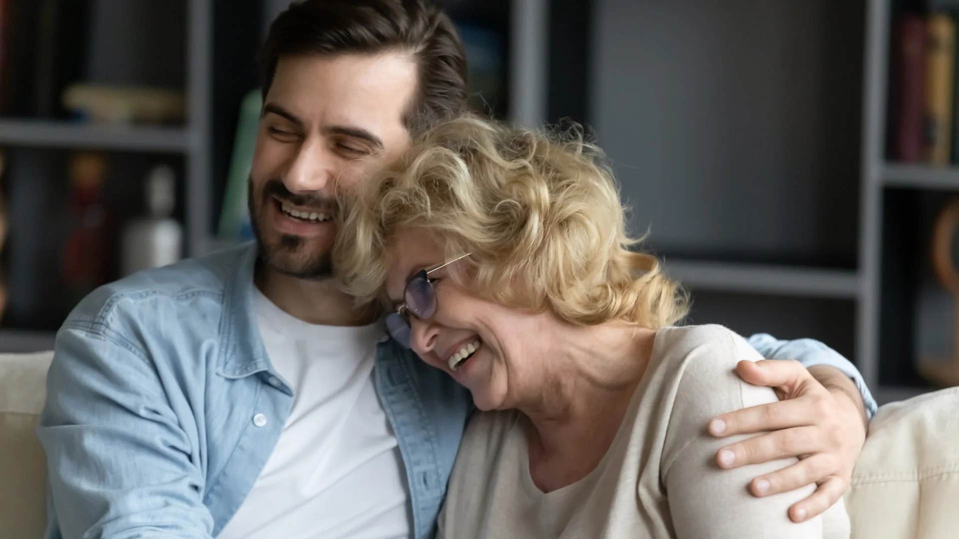 privileged man hugging his mom asking her for help
