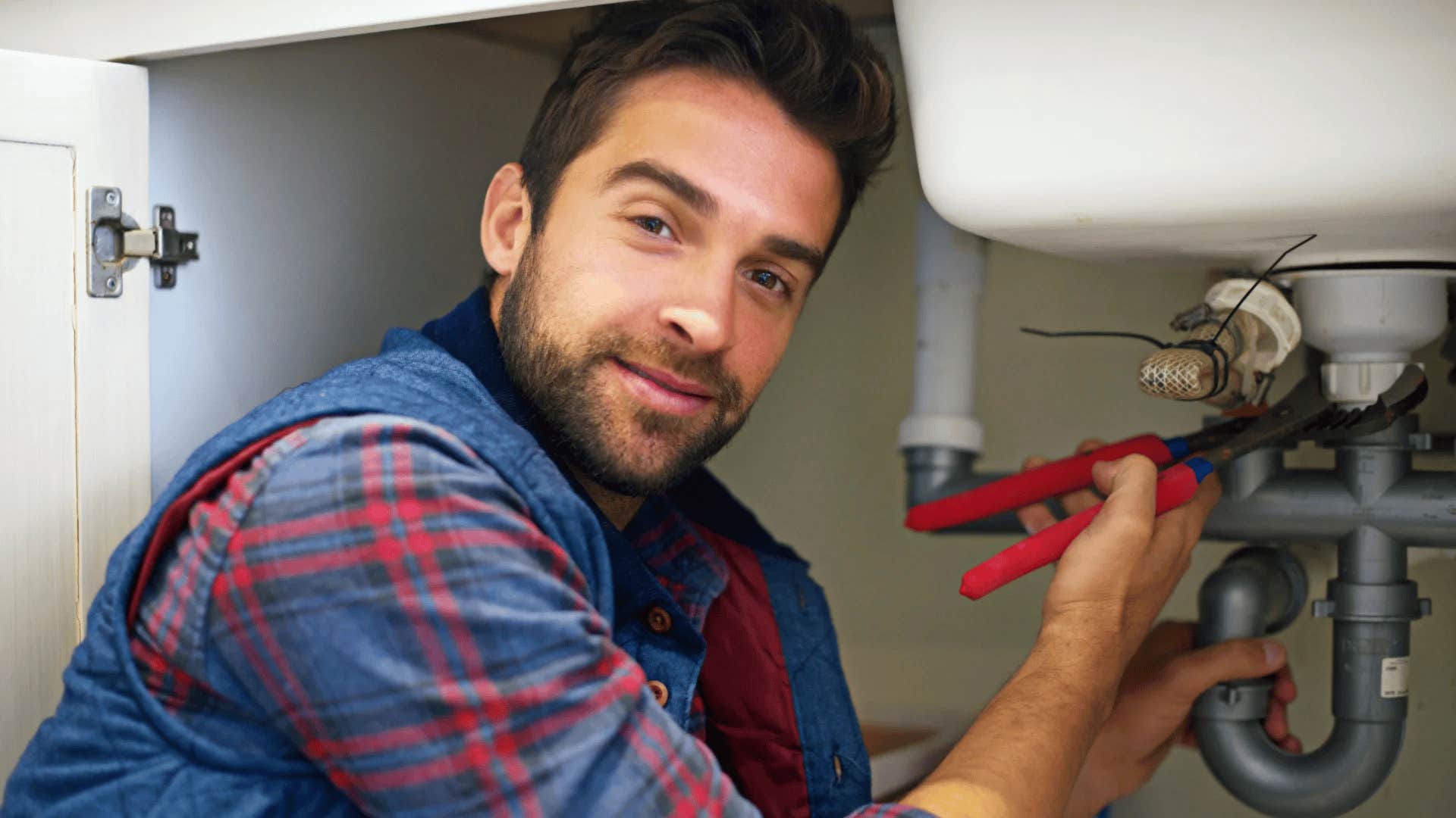 man fixing his sink instead of replacing it