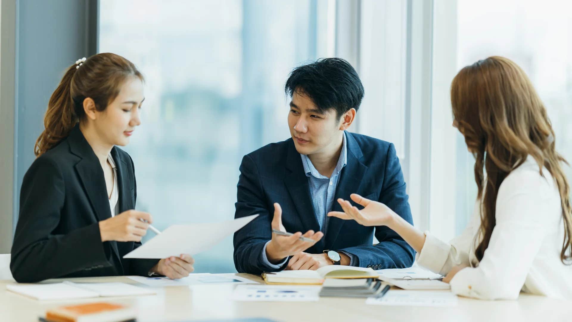 woman telling colleague why should i thank you it's your job