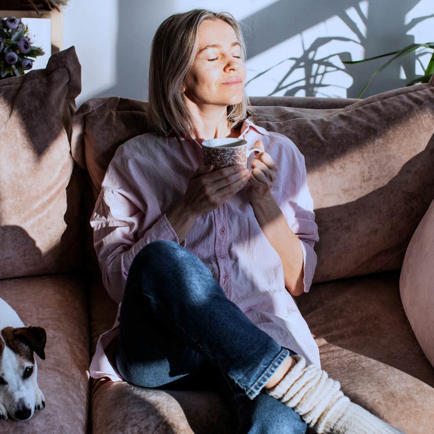 Woman who's comfortable with her own body at home.