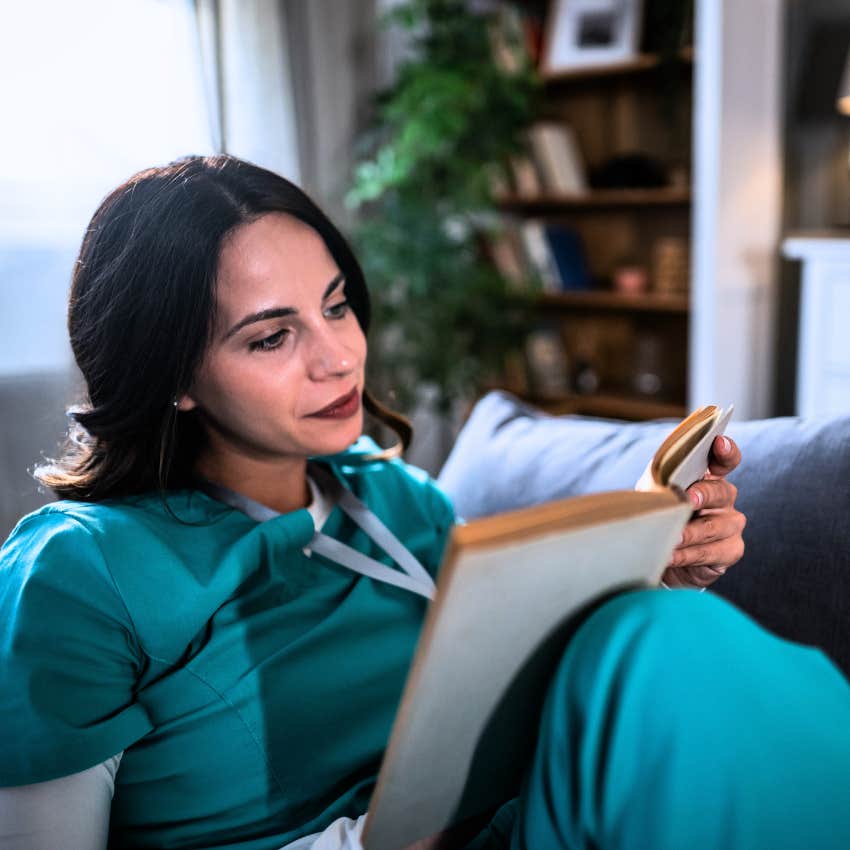 Patient woman reading alone at home.