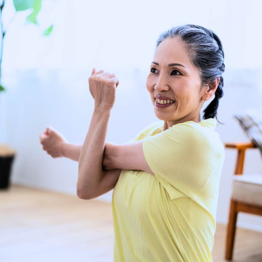 woman stretching and doing yoga as a cozy hobby