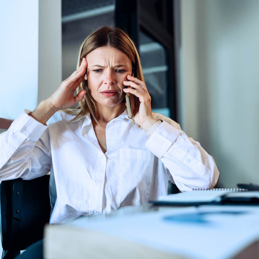 exhausted woman looking worried on the phone saying I just need to emotionally prepare for that