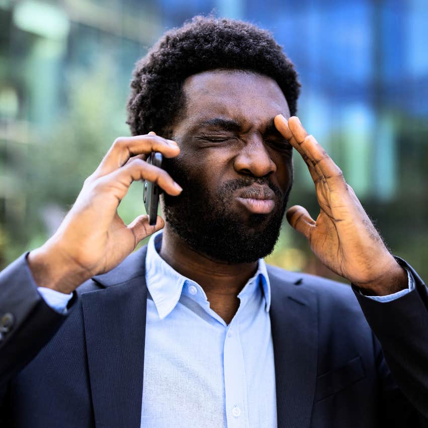 man with financial stress saying I can't deal with this right now on the phone