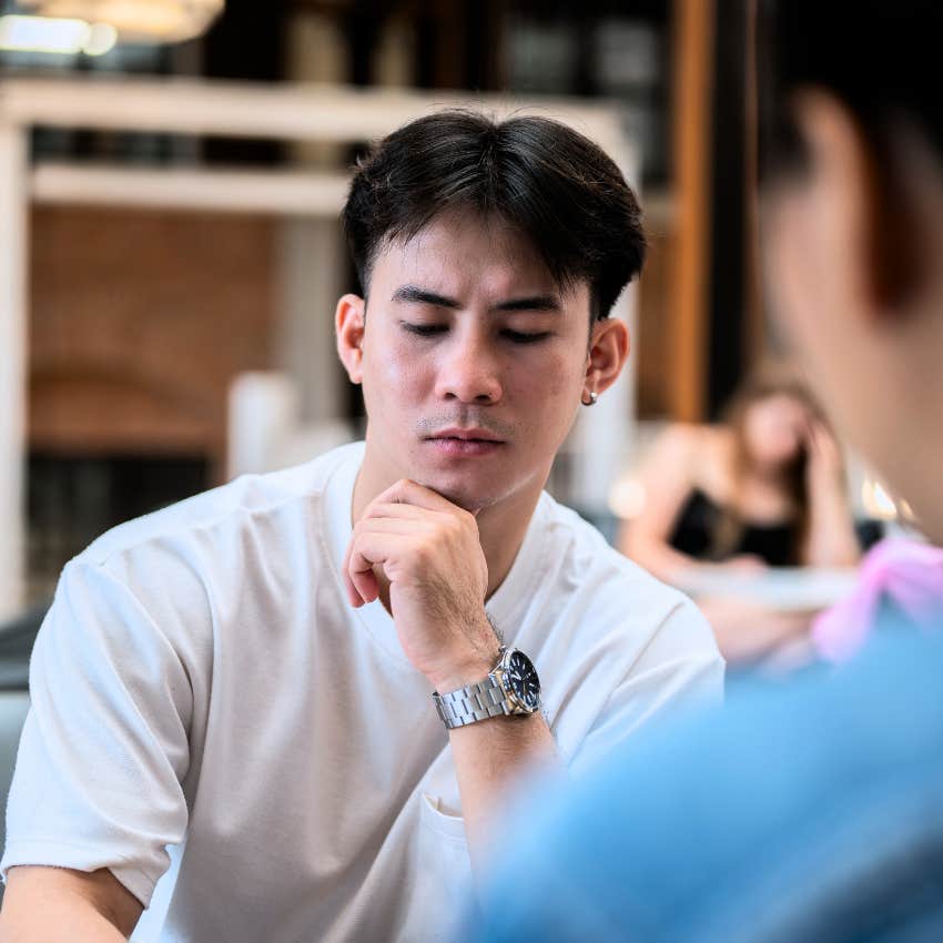 man in deep financial stress telling friend we're just saving right now