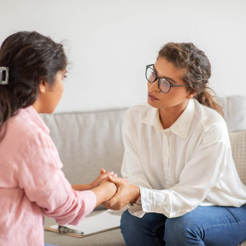 bright woman offering to help another person