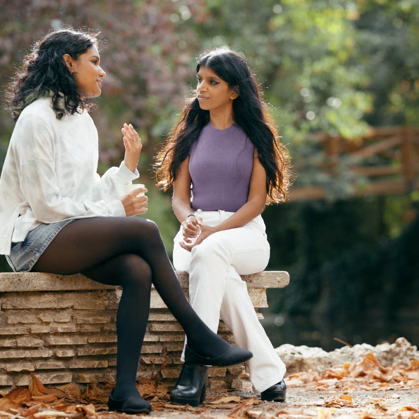 two bright women talking and staying present outdoors