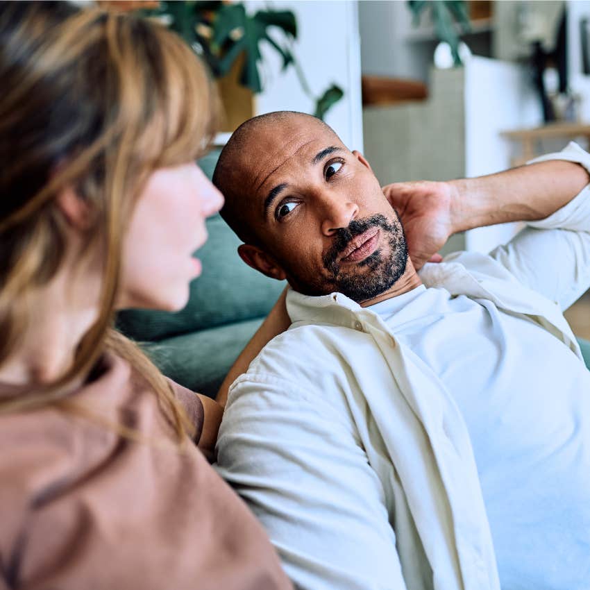 Man saying "What am I supposed to do about it?" to his partner.