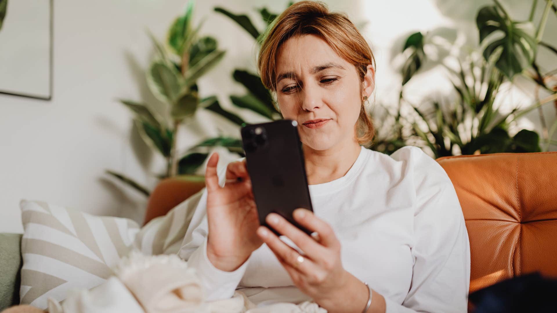 woman texting her friends to go without her