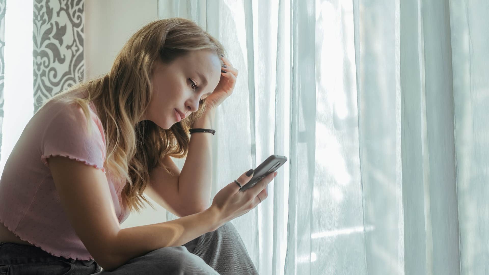 woman telling her friends she's too tired to be social