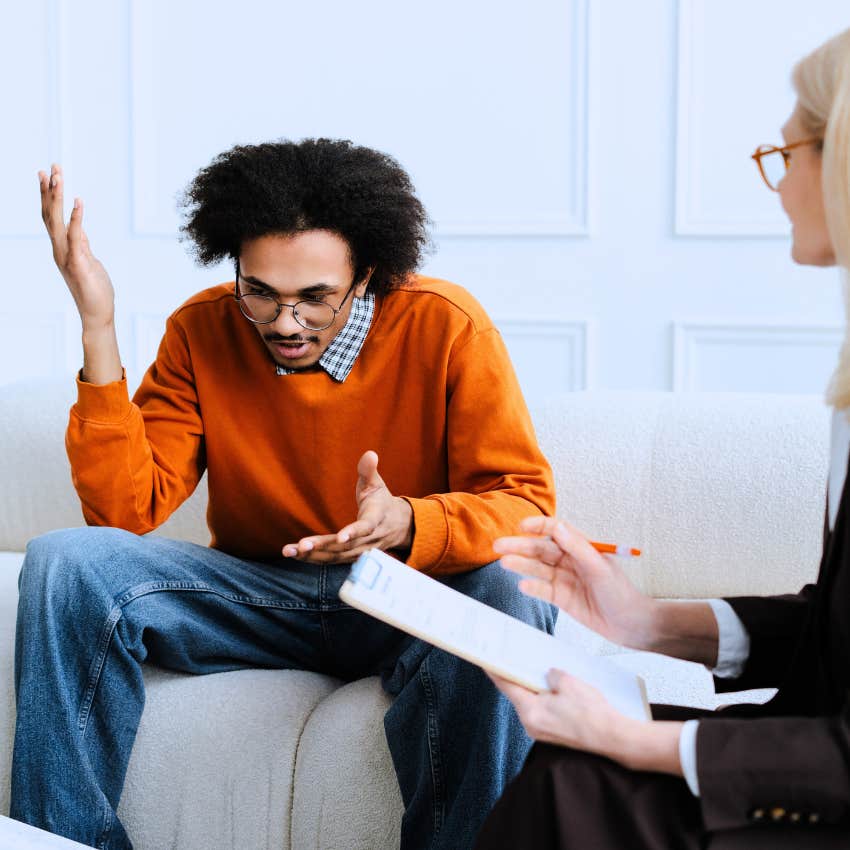 stressed man saying it's out of my control to his boss