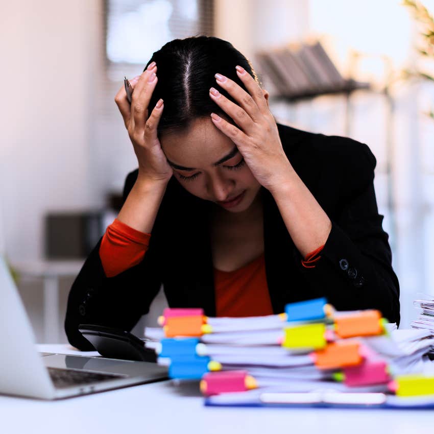 stressed worried woman at work saying this is impossible