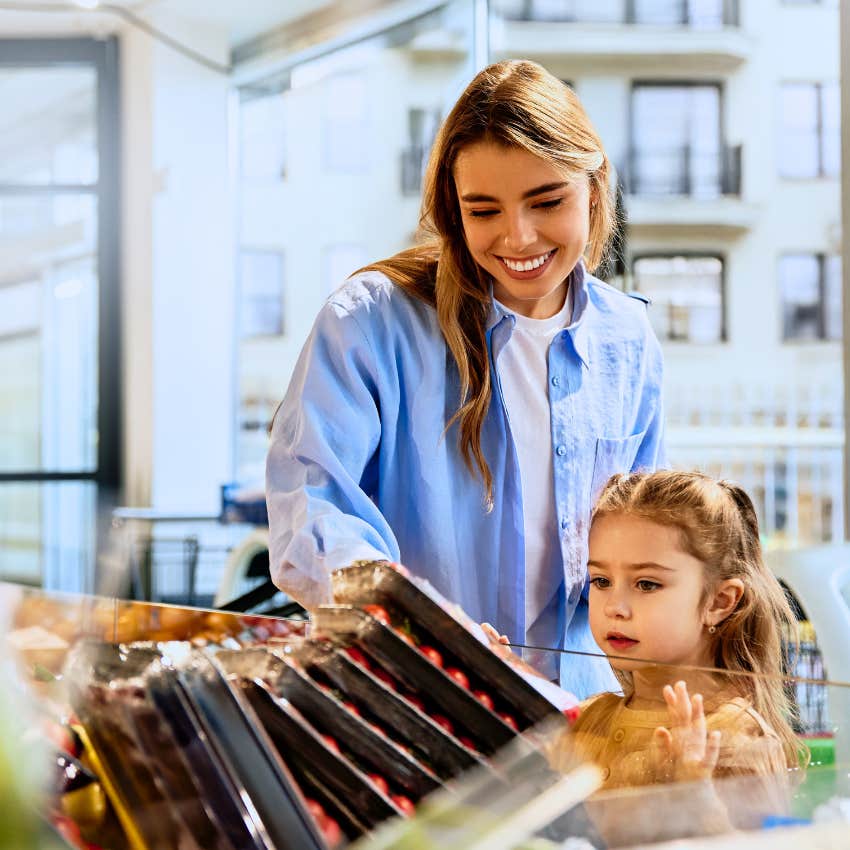 woman shopping with daughter buying something just because it's on sale