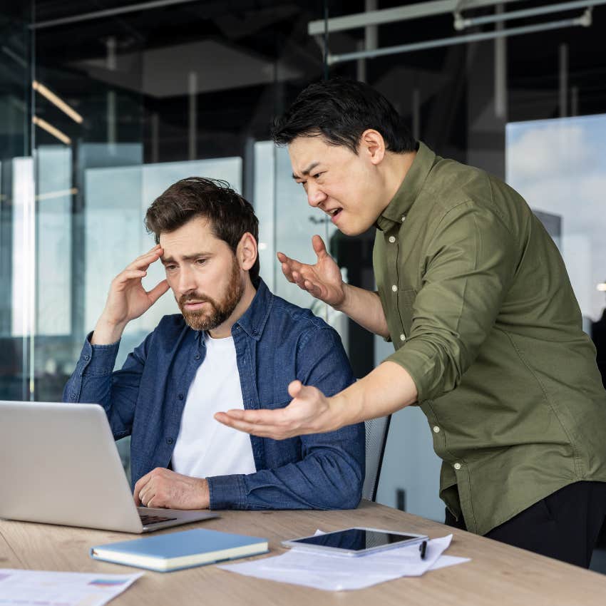 weak boss blaming employee saying that's your fault in argument