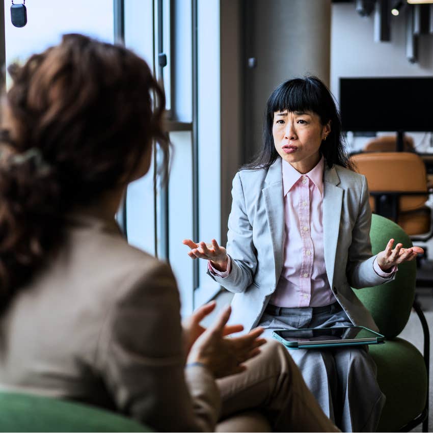 Small-minded woman saying "we need to be realistic" at work.