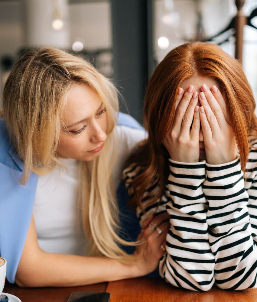 high vibe woman comforts her sad friend 