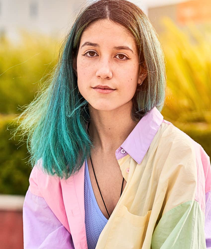 Young woman who is highly intuitive thinking for a moment 