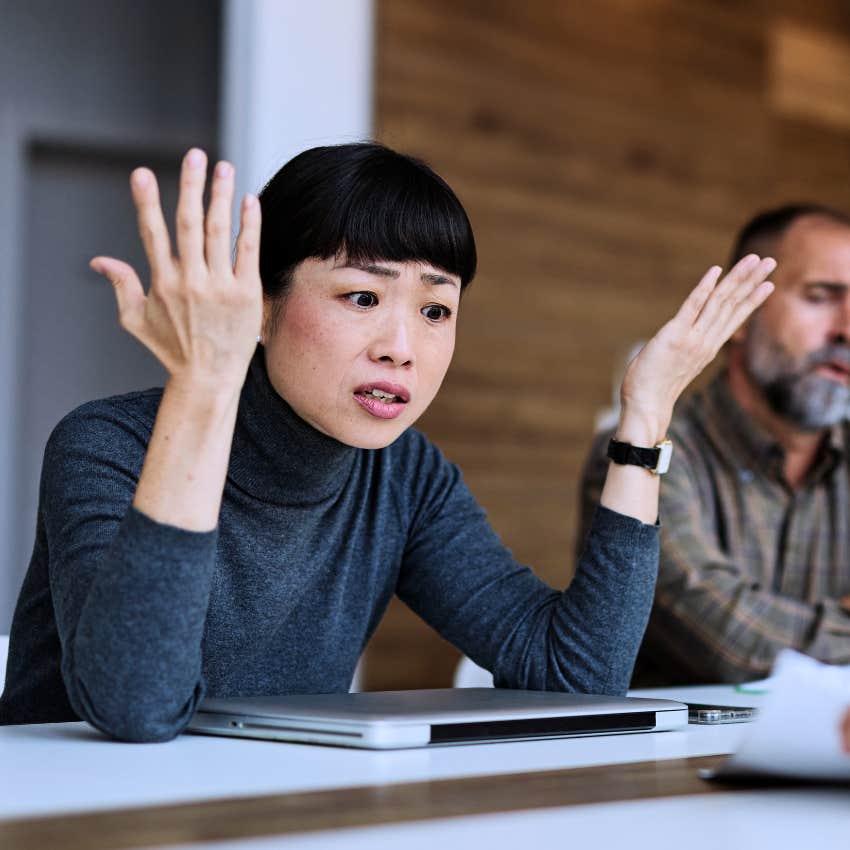 immature woman frustrated at work saying I didn't mean to