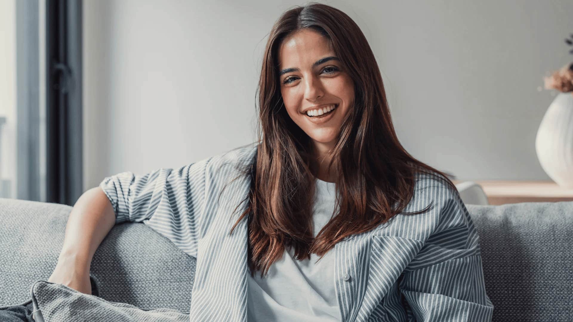 happy woman smiling because she's emotionally aware