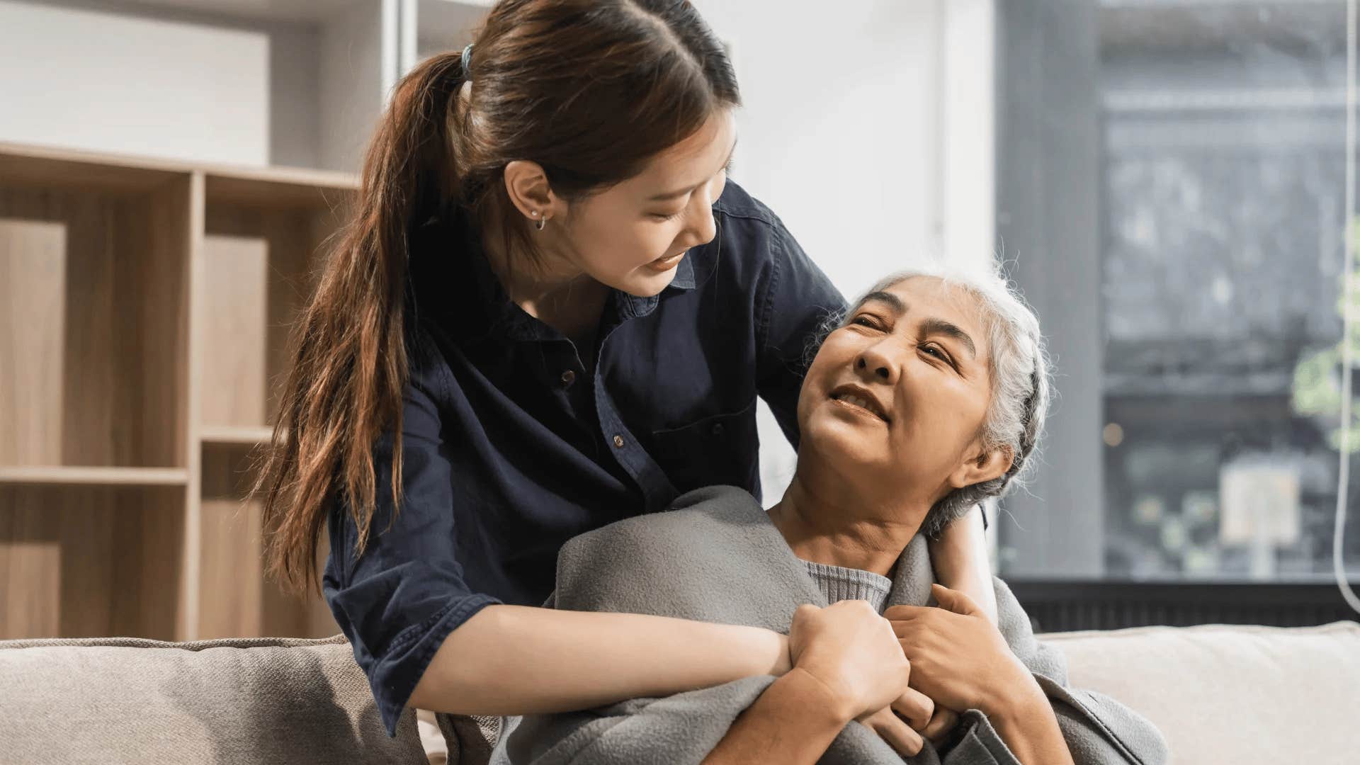 empathetic woman hugging her mom