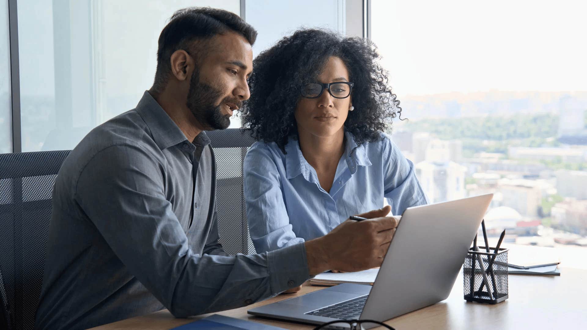 intuitive and curious man asking for help from colleague