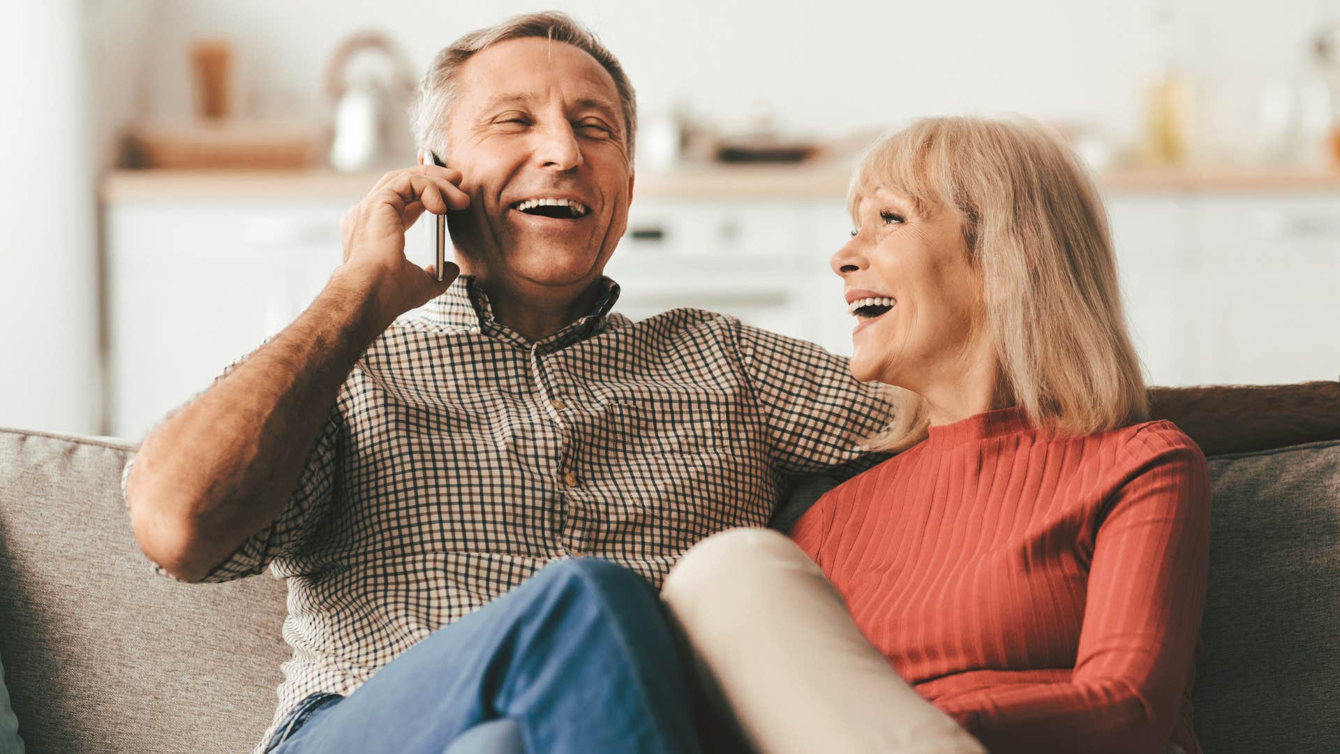 happily married man telling friend over phone that his wife made a great point