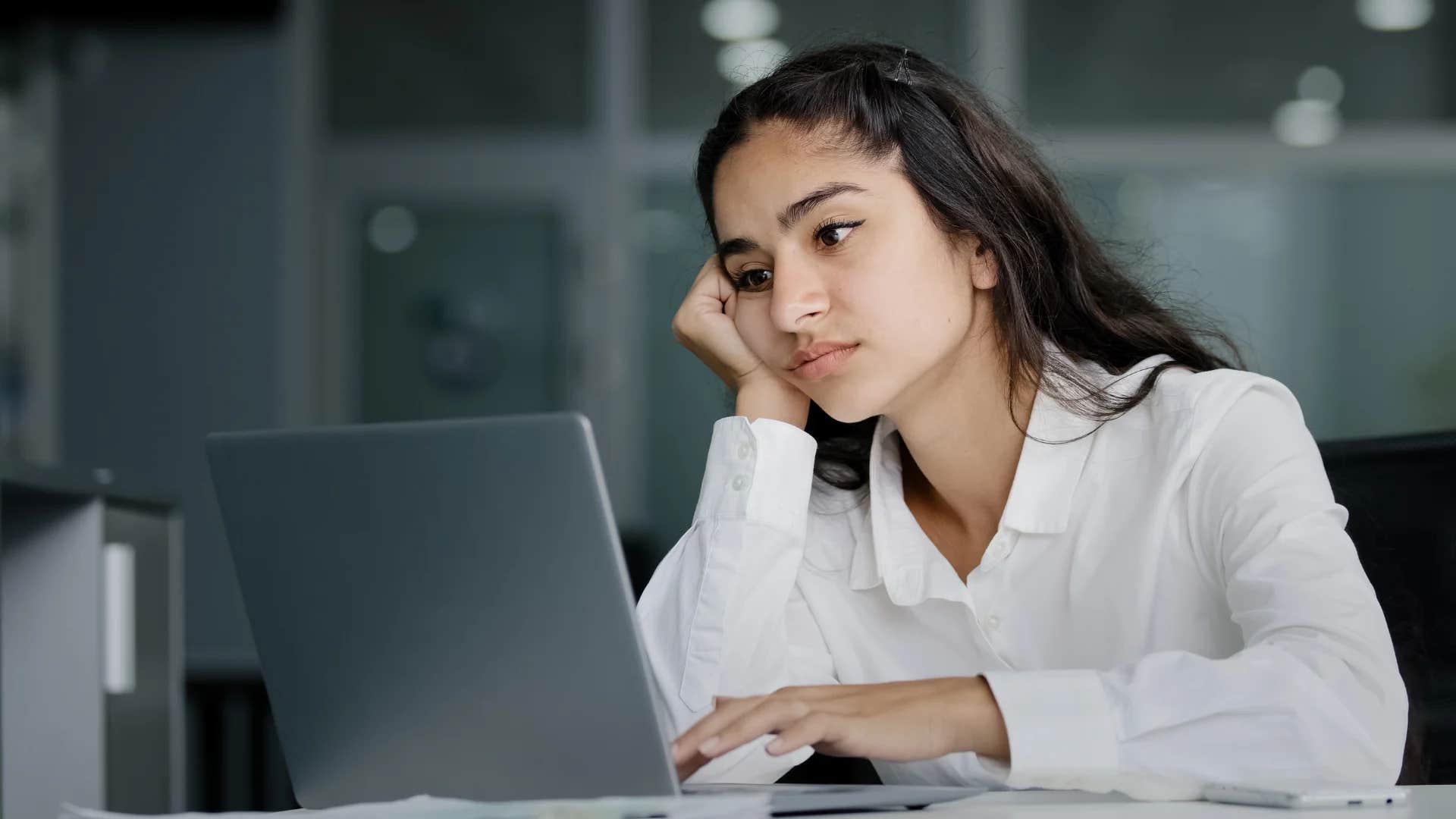 stressed employee slacking off at work saying i'll get to it eventually