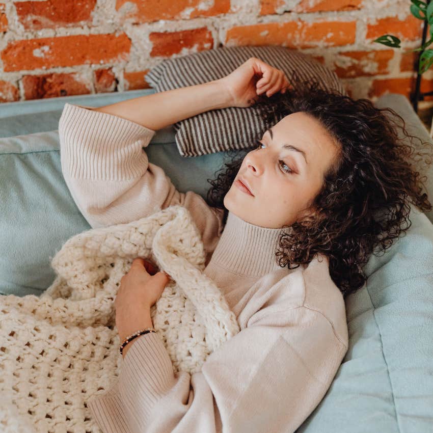 woman relaxing at home procrastinating chores