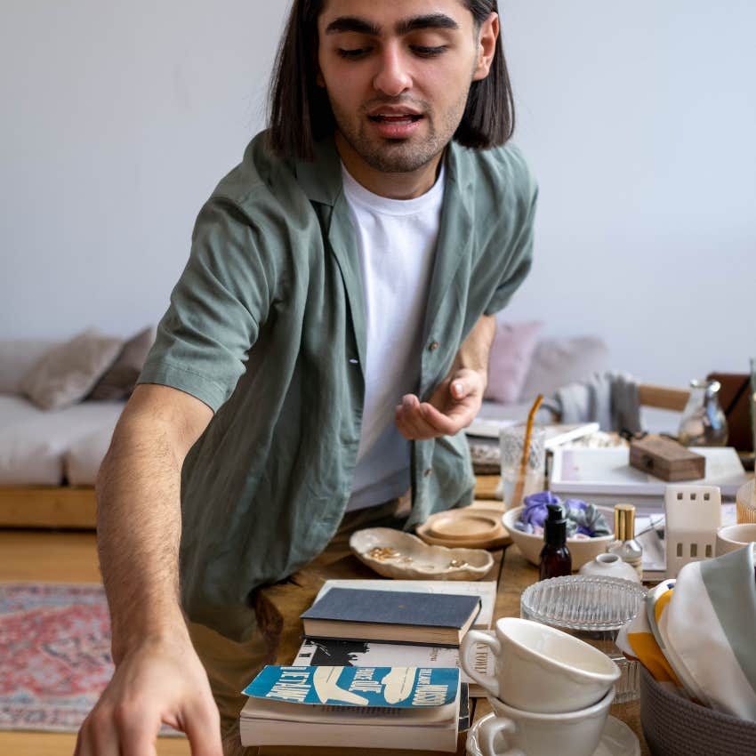 lazy man avoiding housework saying i'll put it here for now
