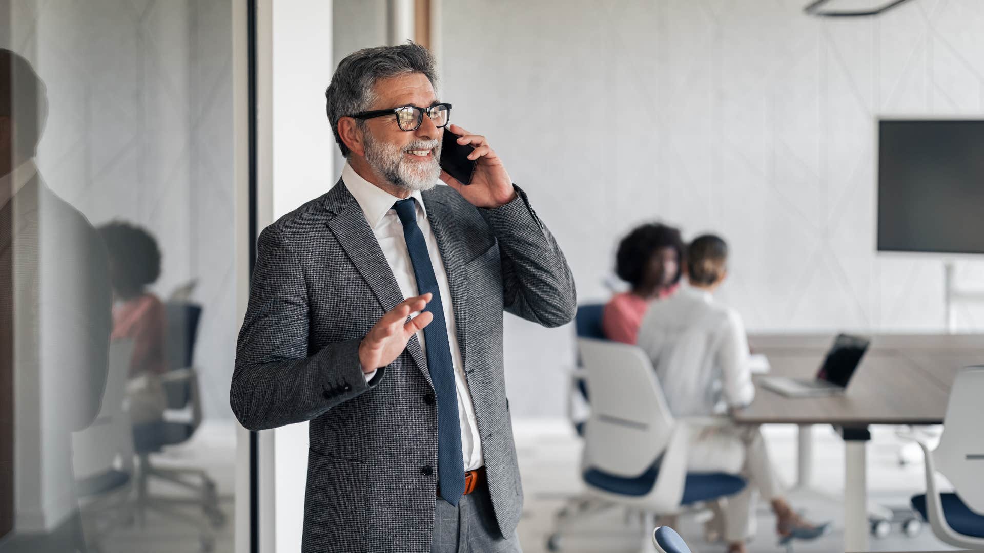 businessman who hates small talk on the phone politely ending conversation