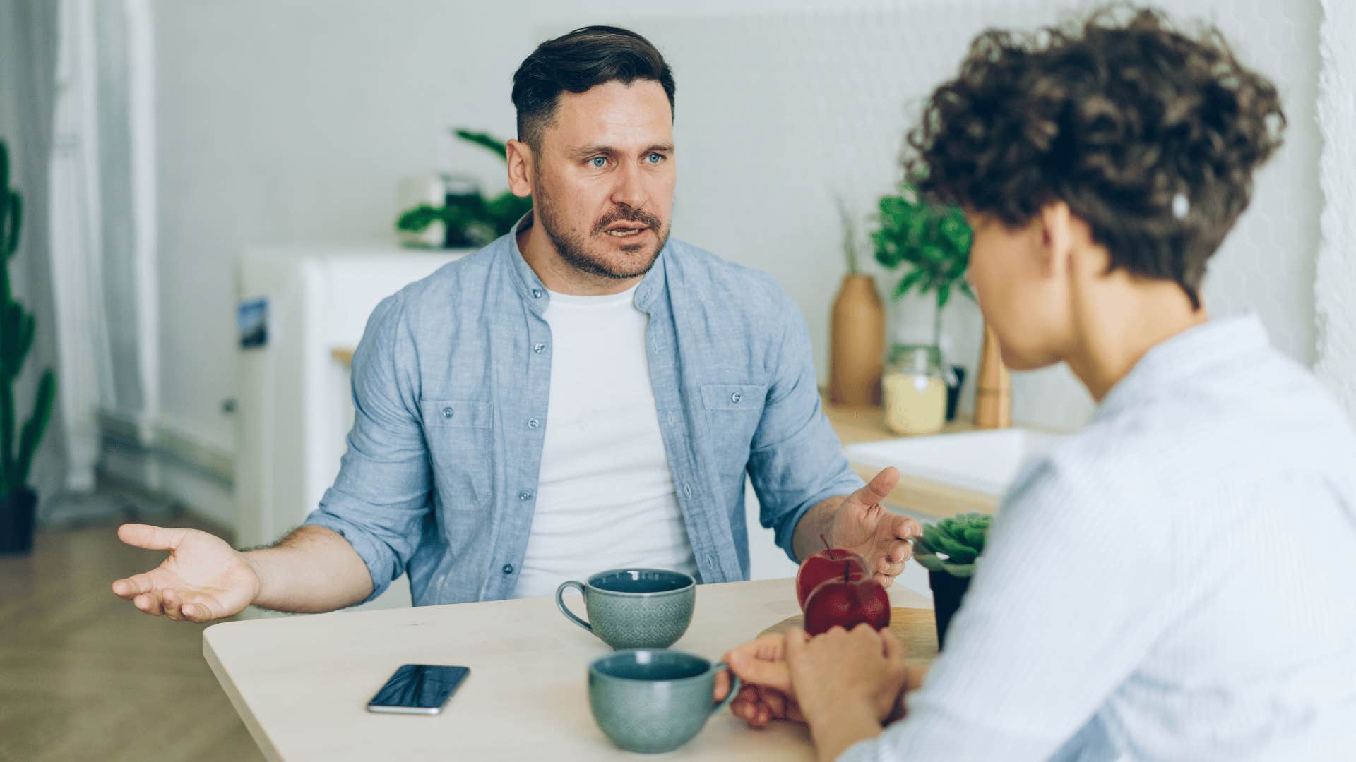 man getting angry with partner accusing her of making everything so deep
