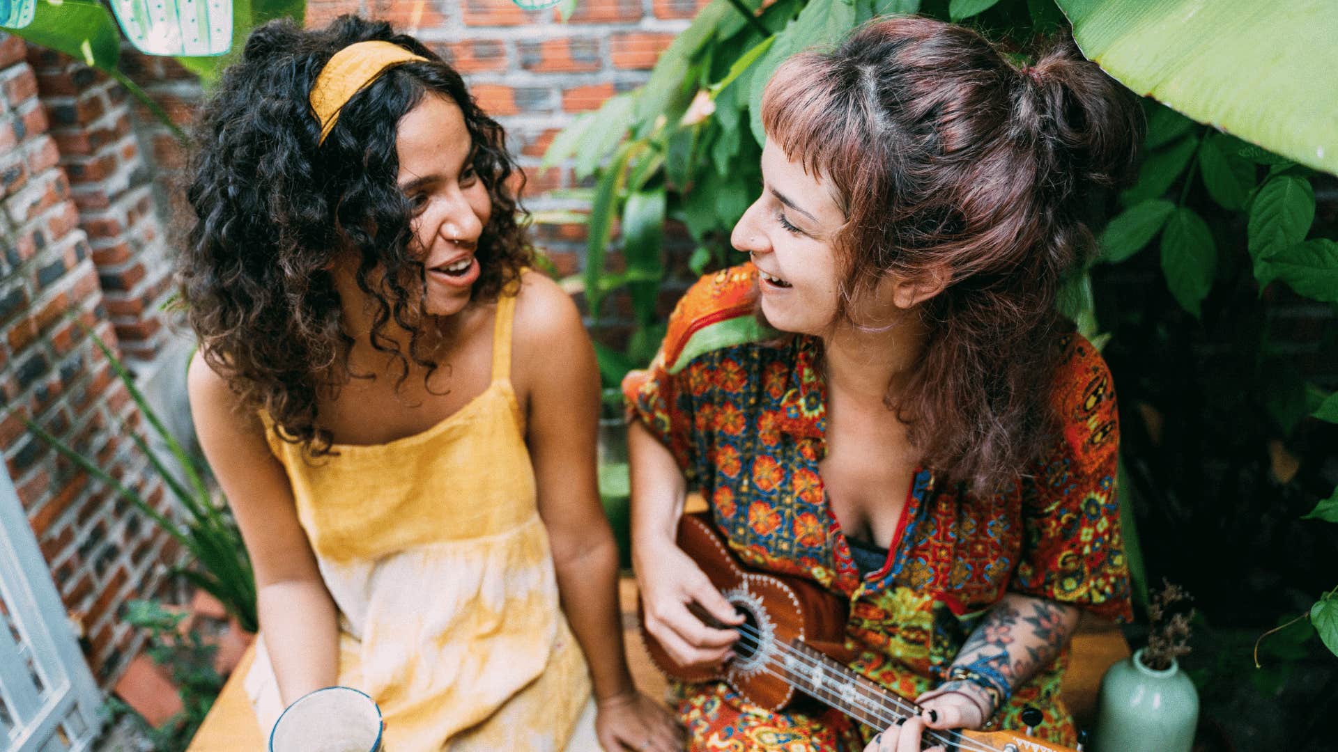 magnetic woman playing the ukulele telling friend i'm glad you're here